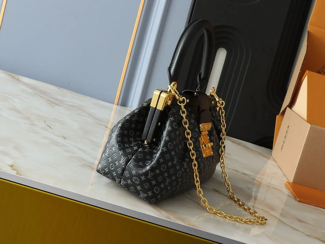 LV Nanogram Embossed Leather Clutch