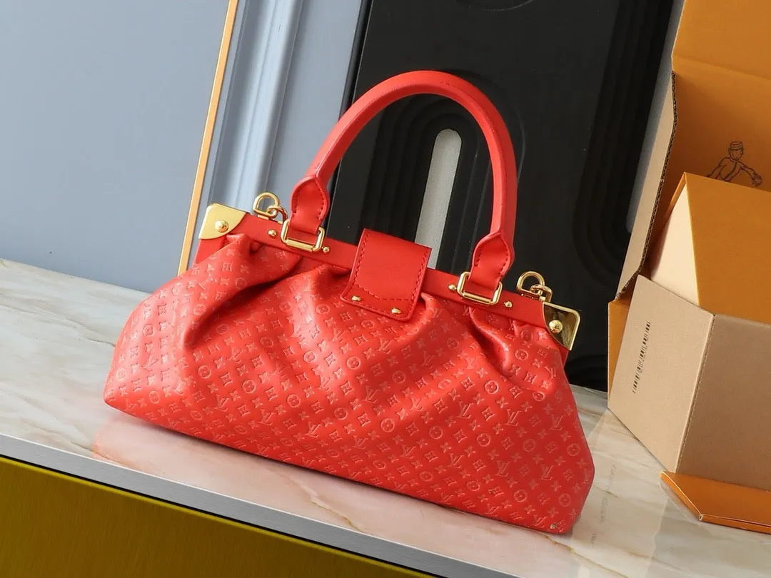 LV Nanogram Embossed Leather Clutch